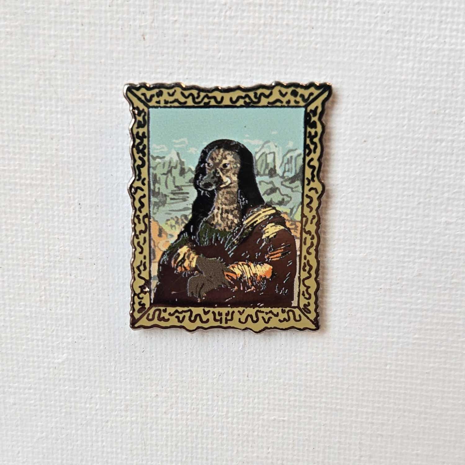Funny enamel pin of Mona Lisa with a seal face in a gold frame on white canvas