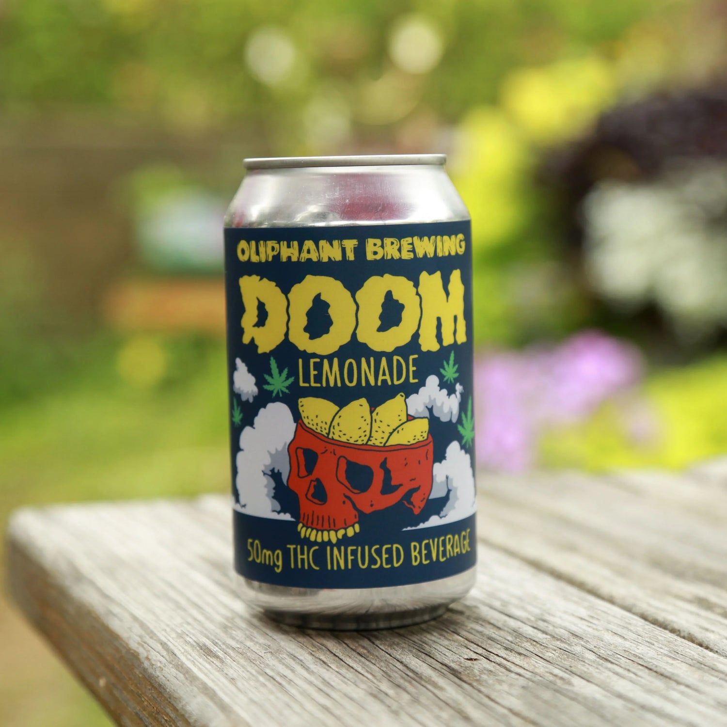 Oliphant Brewing DOOM Lemonade THC infused beverage can on wooden table outdoors