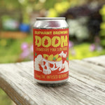 Oliphant Brewing Doom Strawberry Pink Lemonade THC beverage can on outdoor wooden table